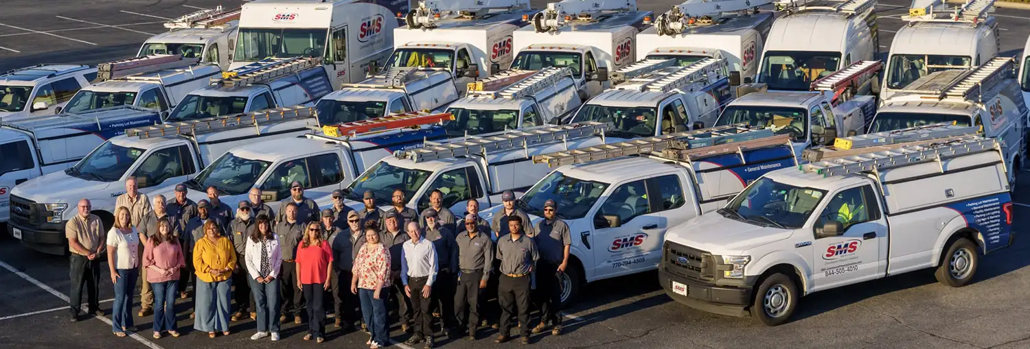 Spectrum Maintenance Services commercial service vehicles and maintenance team