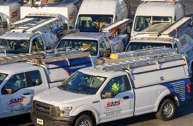 Spectrum Maintenance Services commercial service trucks staged for dispatch across Metro Atlanta